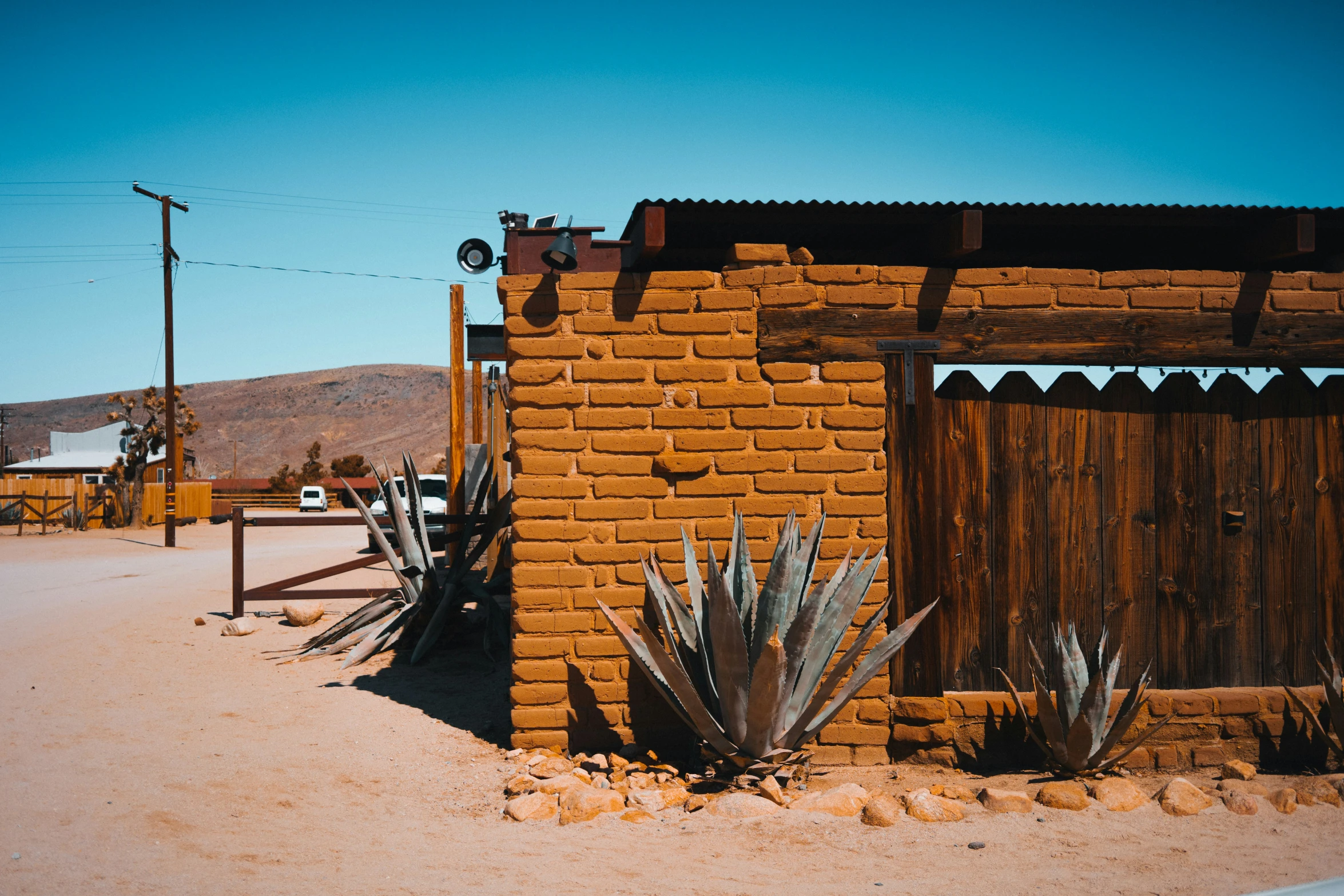 a building with cactus on the outside of it