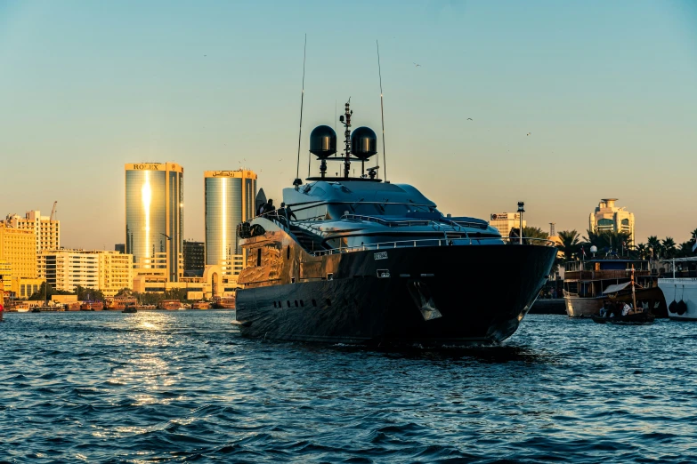 a large ship traveling through a city harbor