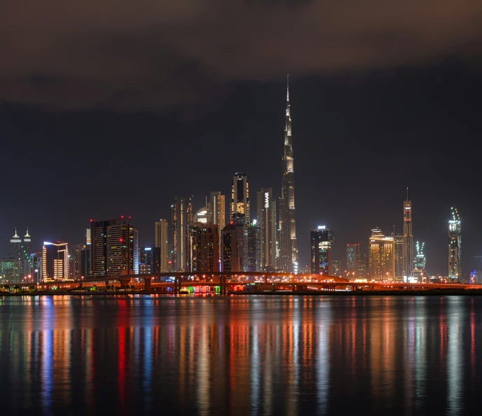 a view of the skyline and its reflection in the water