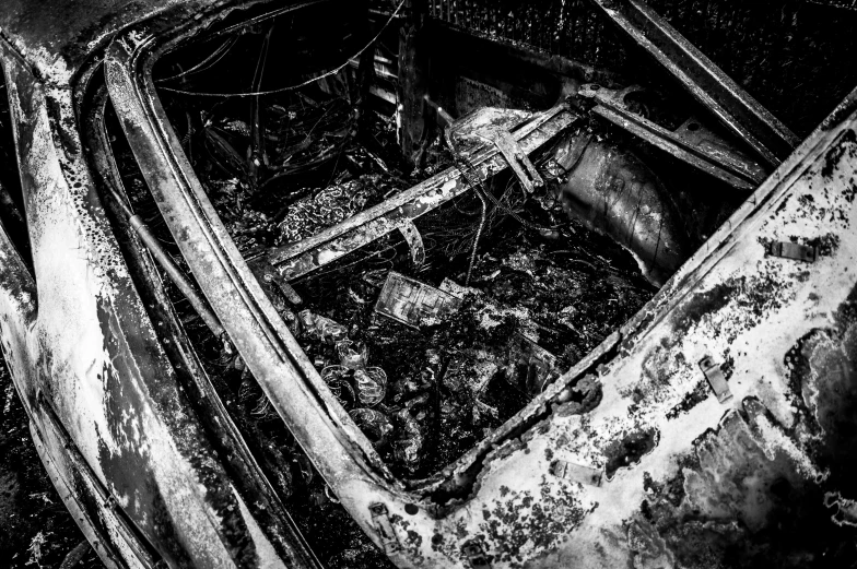 black and white po of an abandoned car with peeling paint