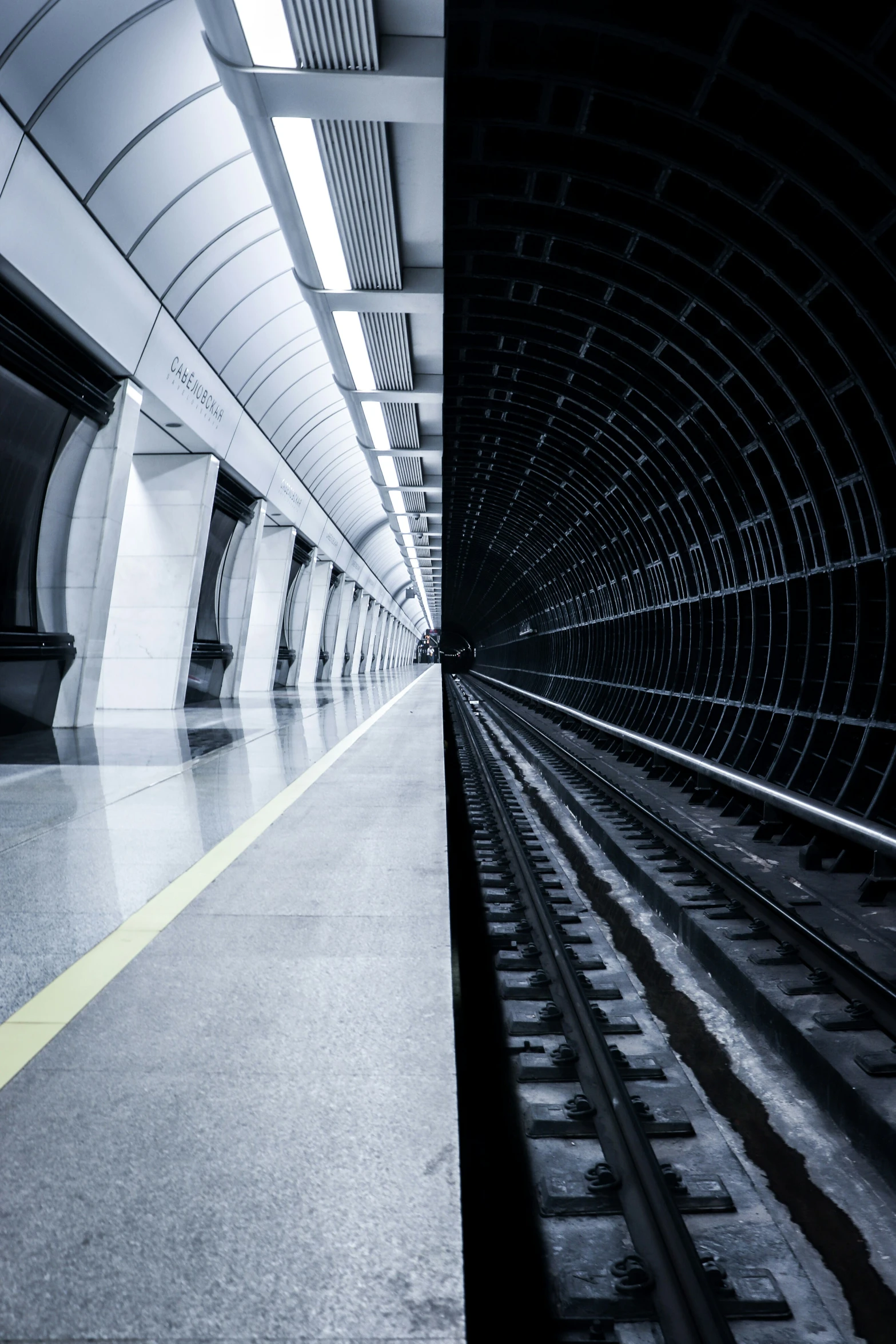 a train on the railroad track and a tunnel