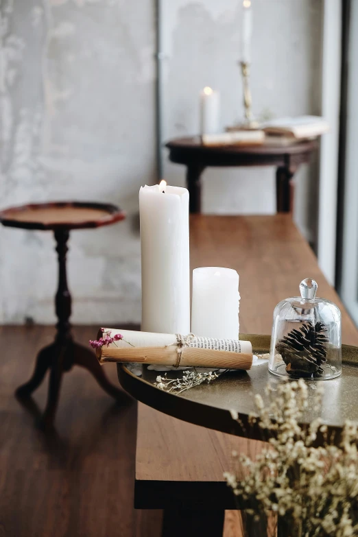 a bunch of candles are on the table in front of other decorations