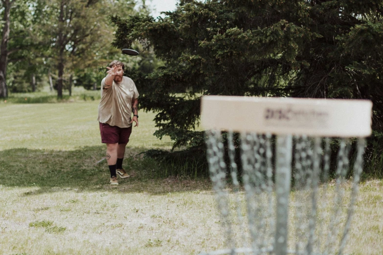 a man throwing a frisbee in the park