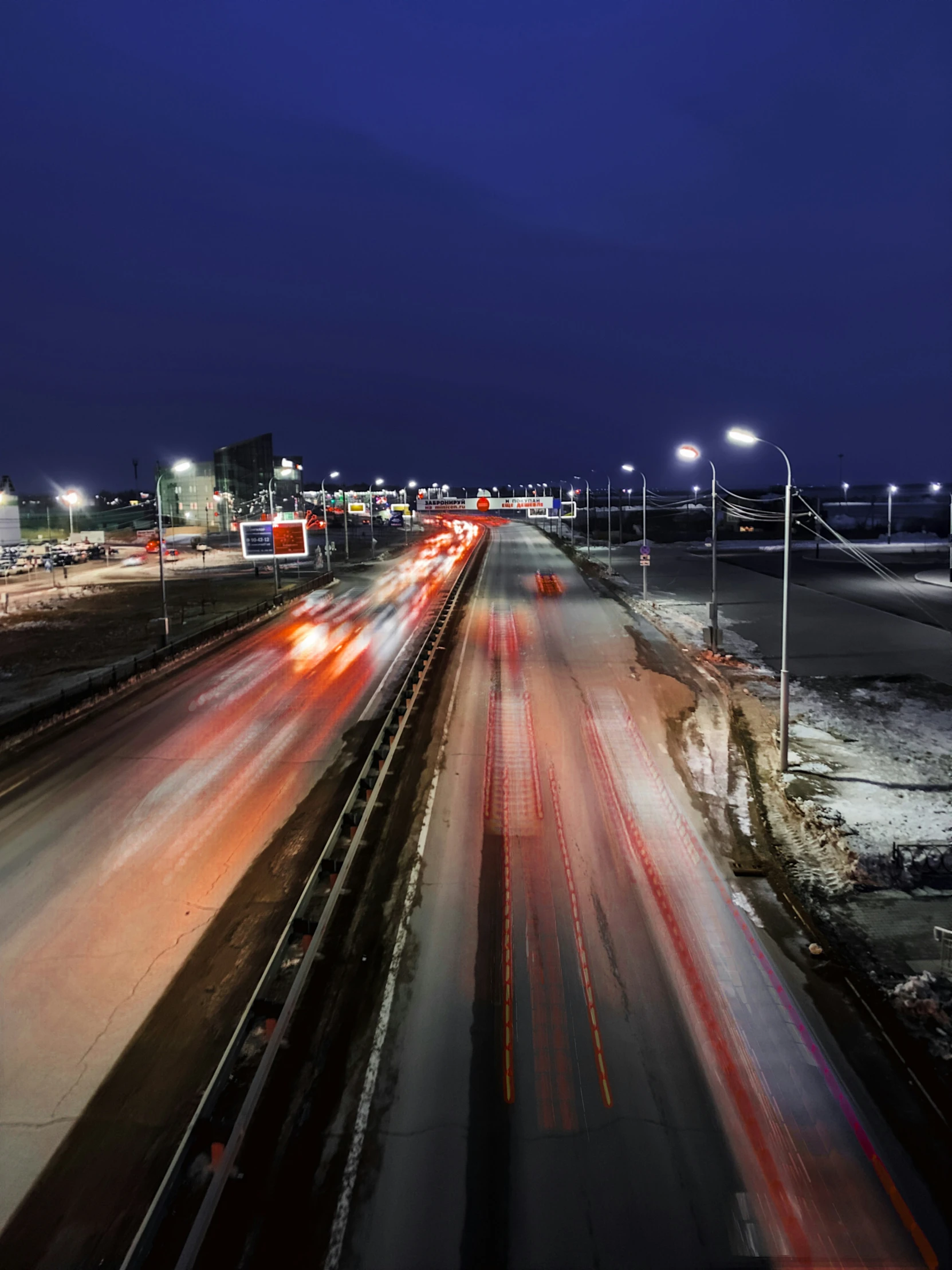 a freeway with many lanes filled with traffic