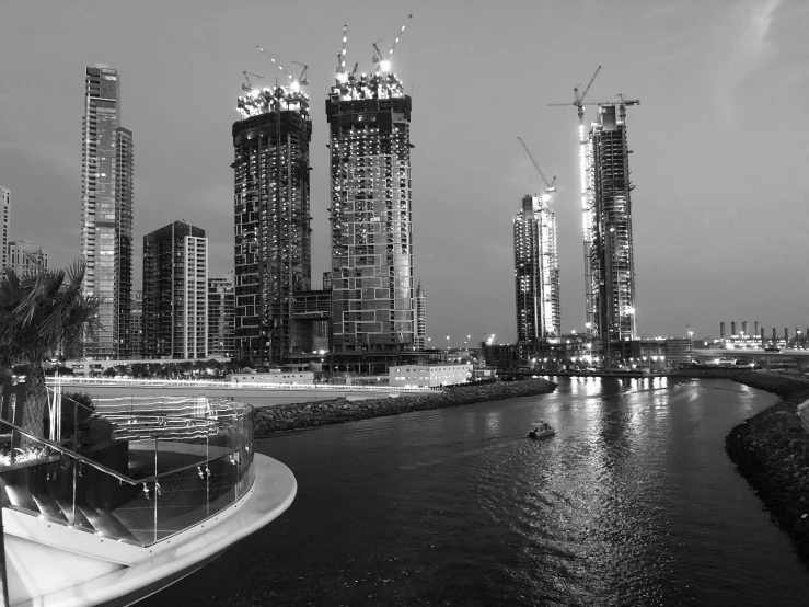 a city on a river surrounded by tall buildings