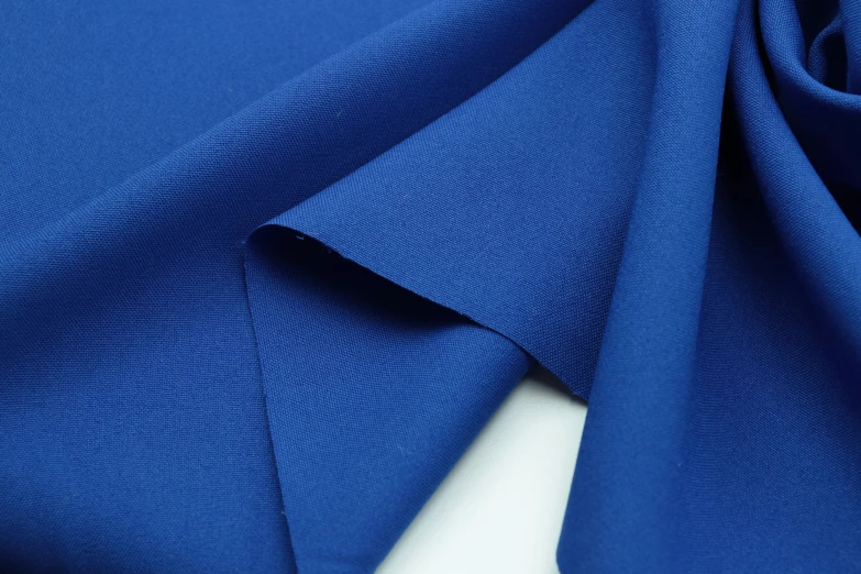 a bright blue plain cloth is folded down