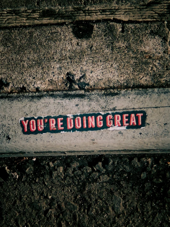 a street sign with the words you're doing great on it