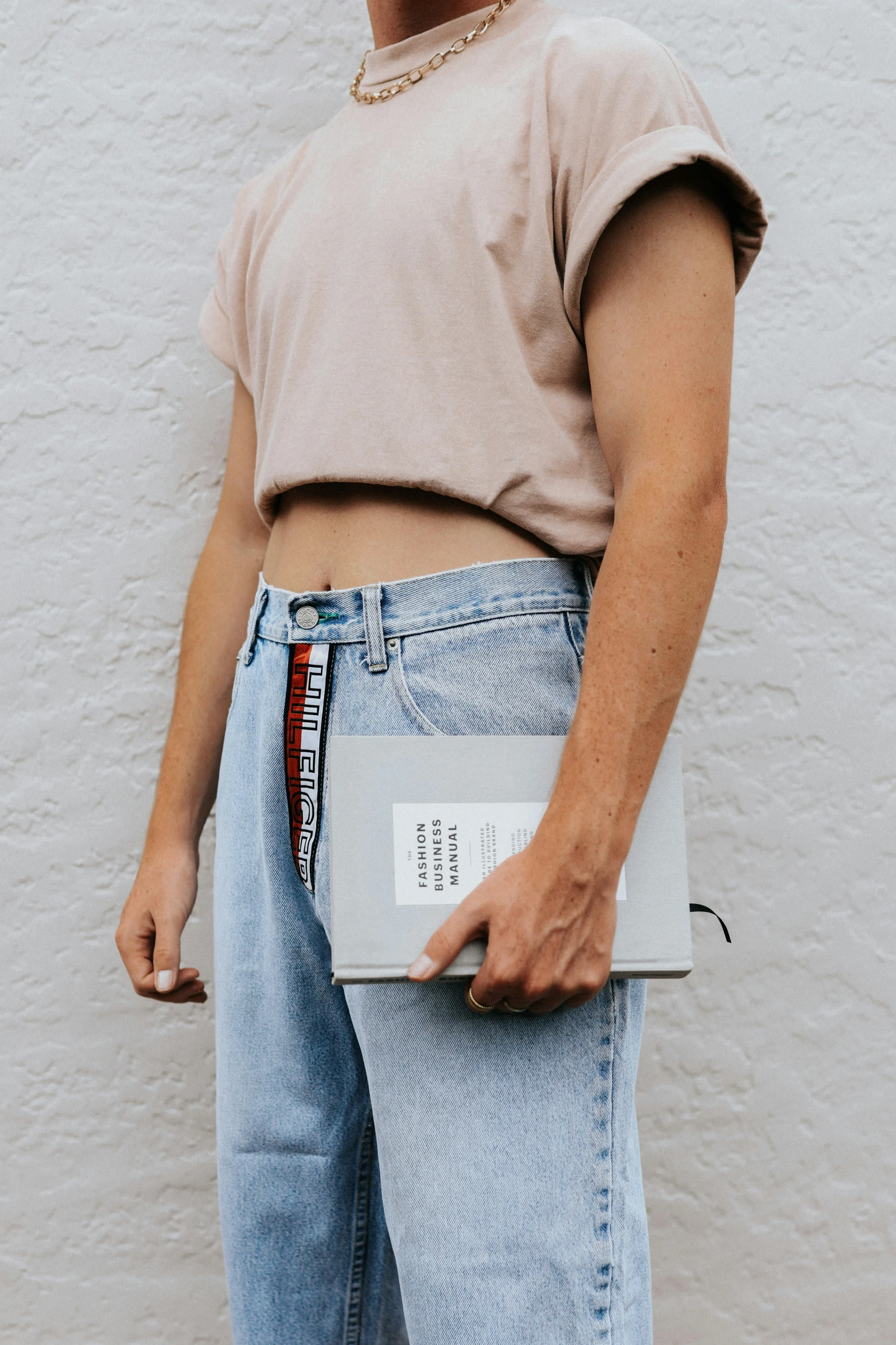 a woman holding an open laptop on her stomach