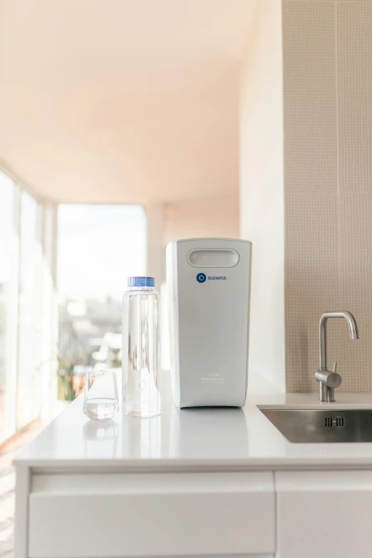 a white kitchen counter top with a water dispenser