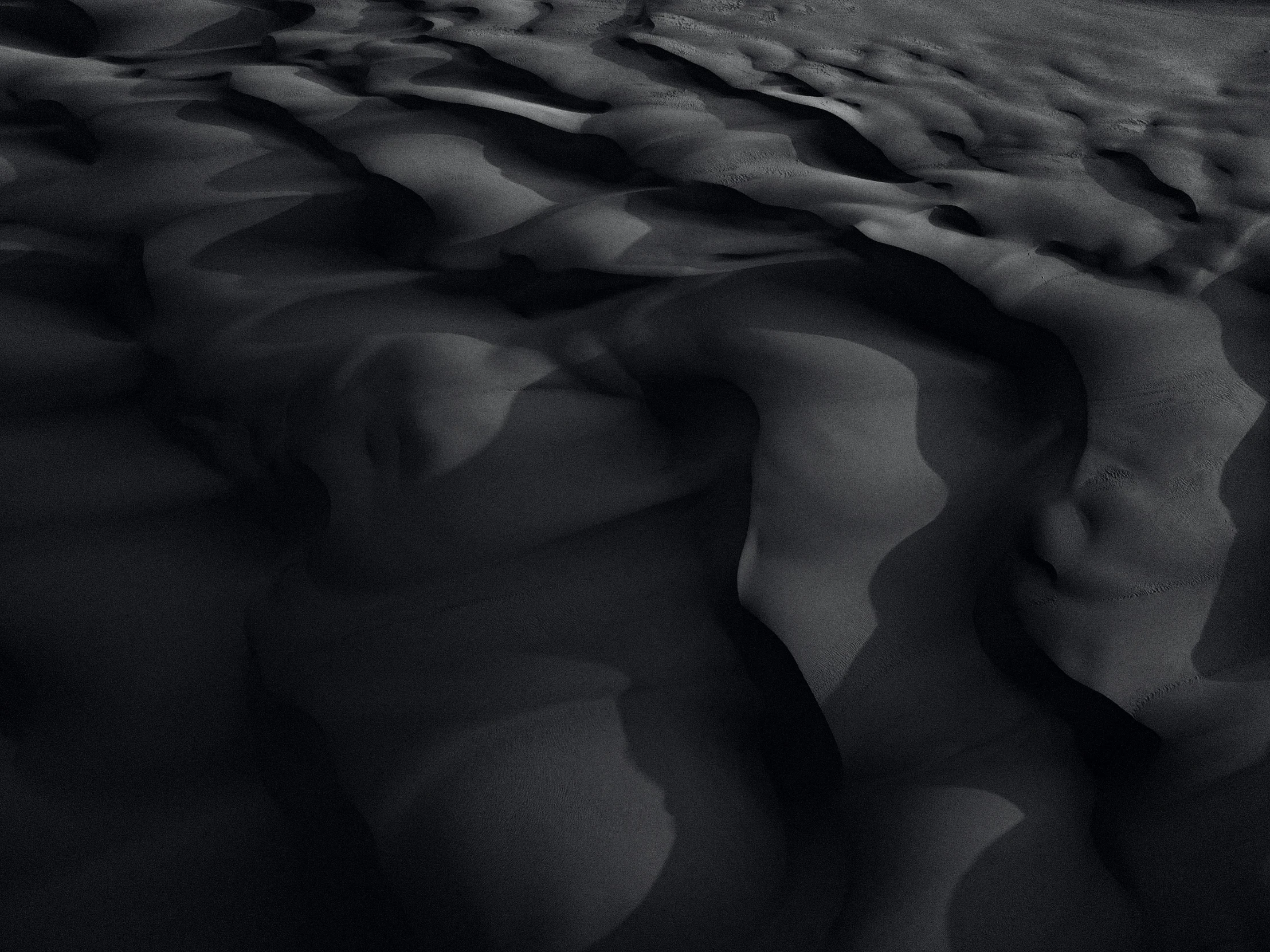this is an black and white pograph of sand
