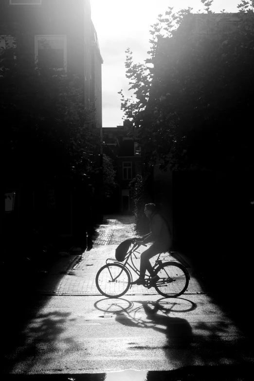 a person riding their bike down the sidewalk