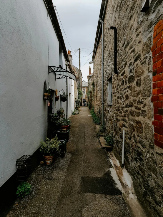 narrow alley in the old town with cobblestones