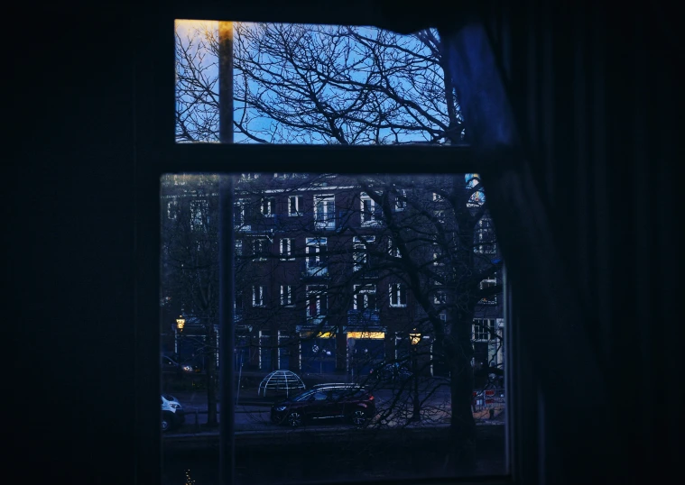 the view outside of an empty window at night