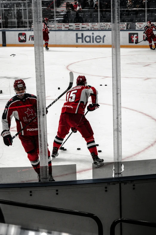 a hockey player running across a hockey field on the ice