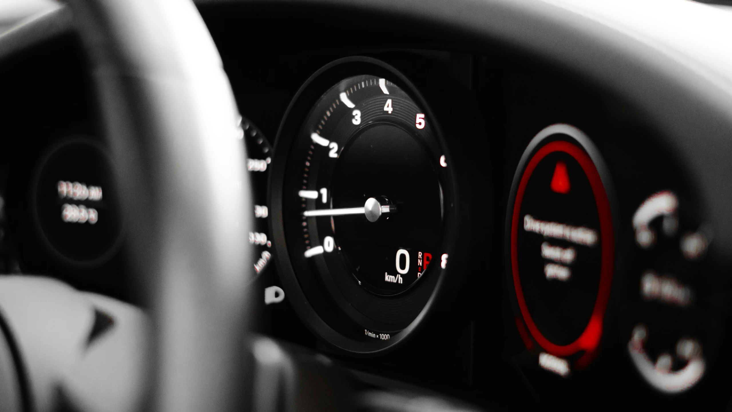 a car dashboard with various gauges and steering ons