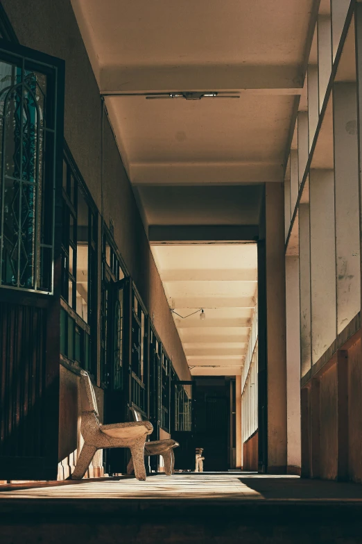 a very large, long hallway with several windows on either side