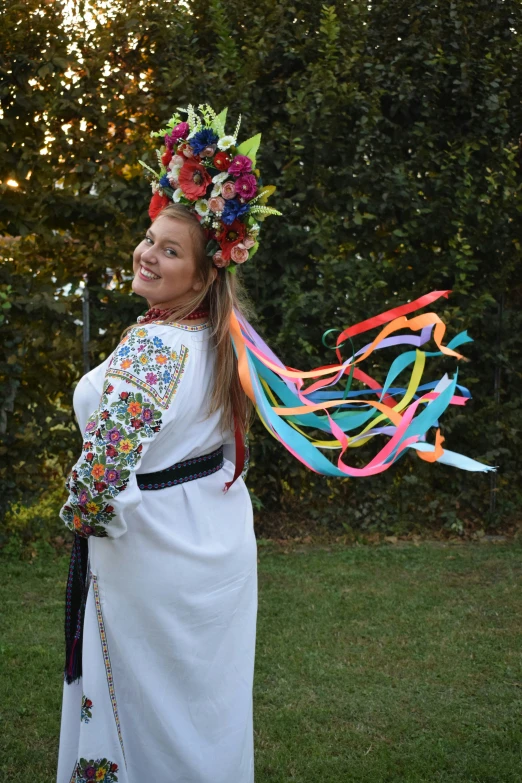 young lady with a ribbon in her hair with the string of streamers flying around her