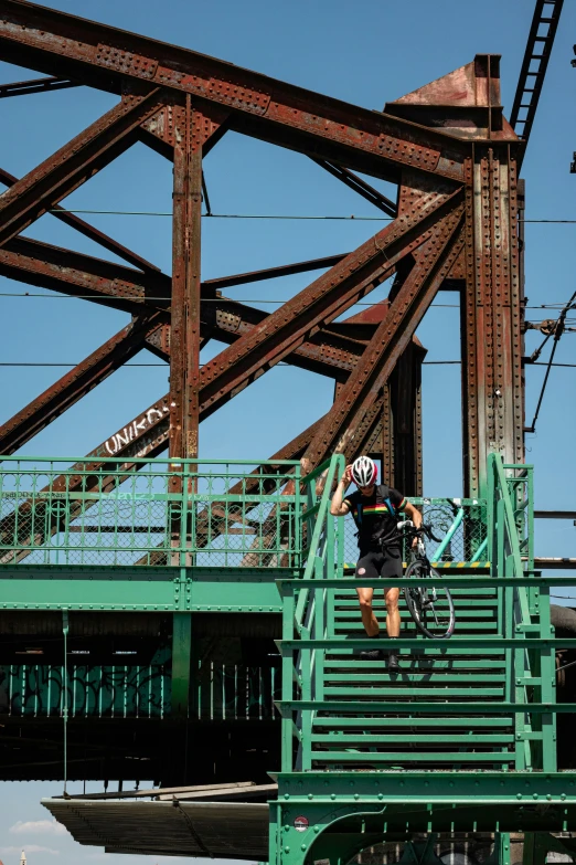 a guy is riding his bike down stairs