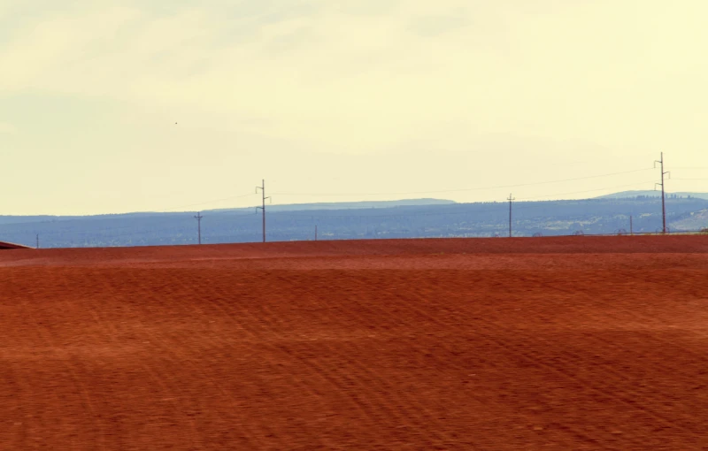 a person riding a bicycle on a dirt road