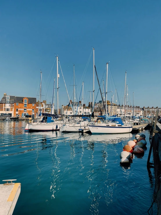 a harbor filled with boats and docked on both sides