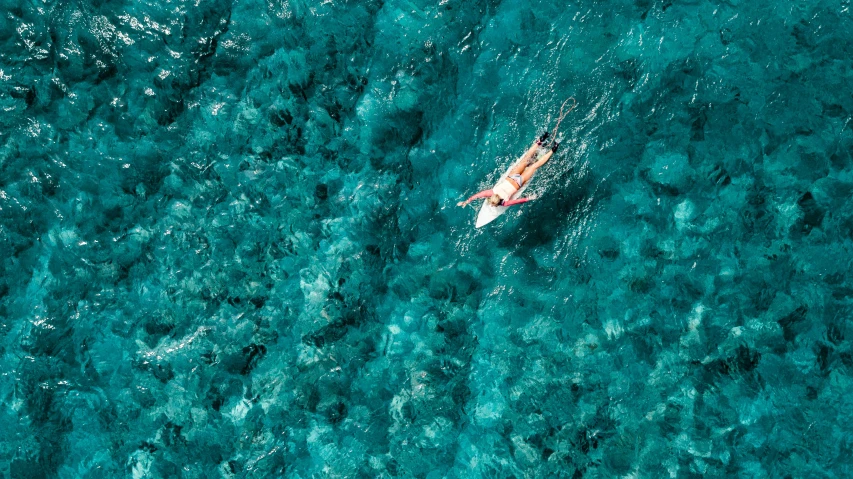 a person is in a kayak with their head close to the water