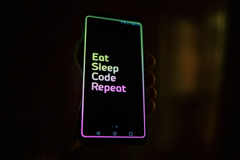 a hand holding a cell phone with the text eat sleep code repeat