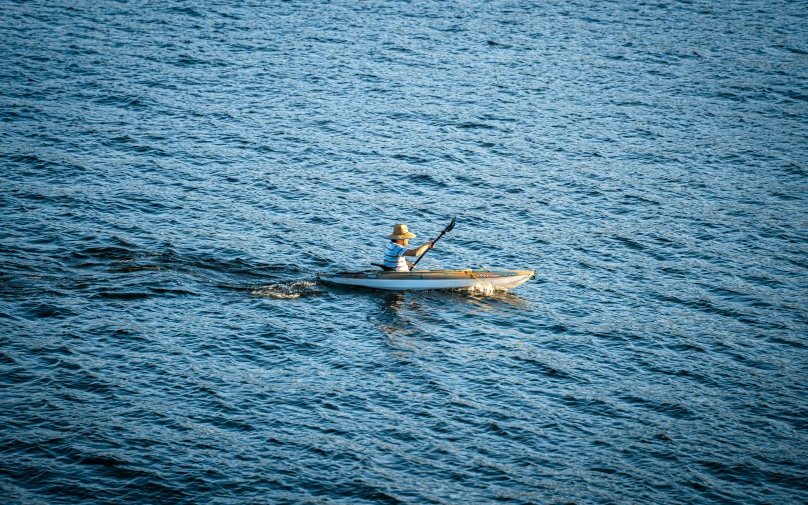 a man is kayaking down a body of water