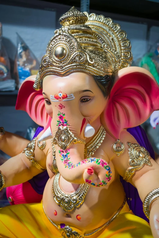 an idol is adorned with decorations for ganesh festival