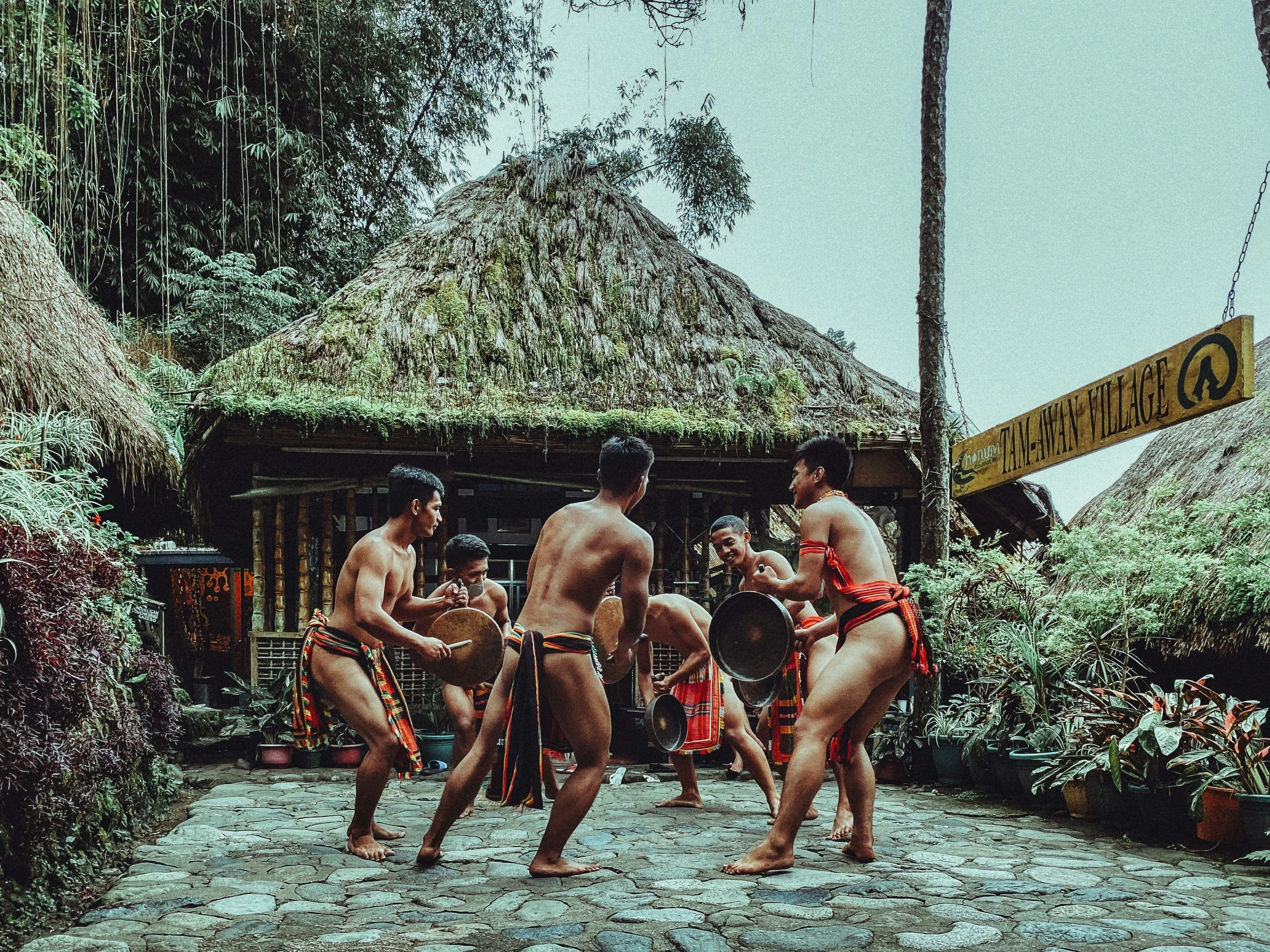 an image of a group of  men dancing outside