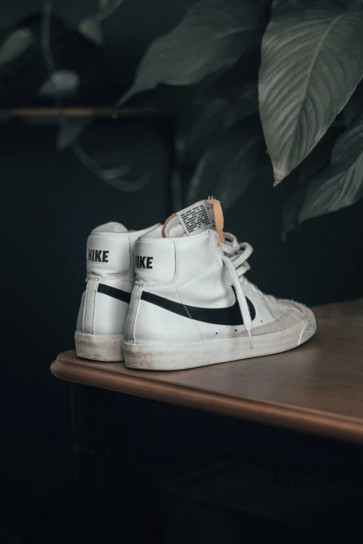 a white sneakers with nike logo on them