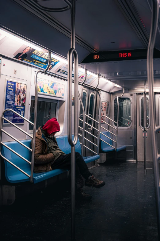 people are waiting for the subway to change colors