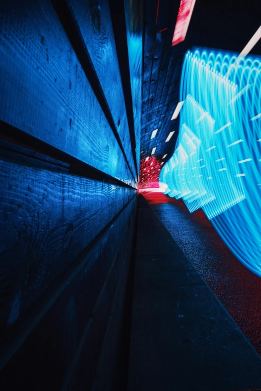 the lights are on inside a tunnel at night