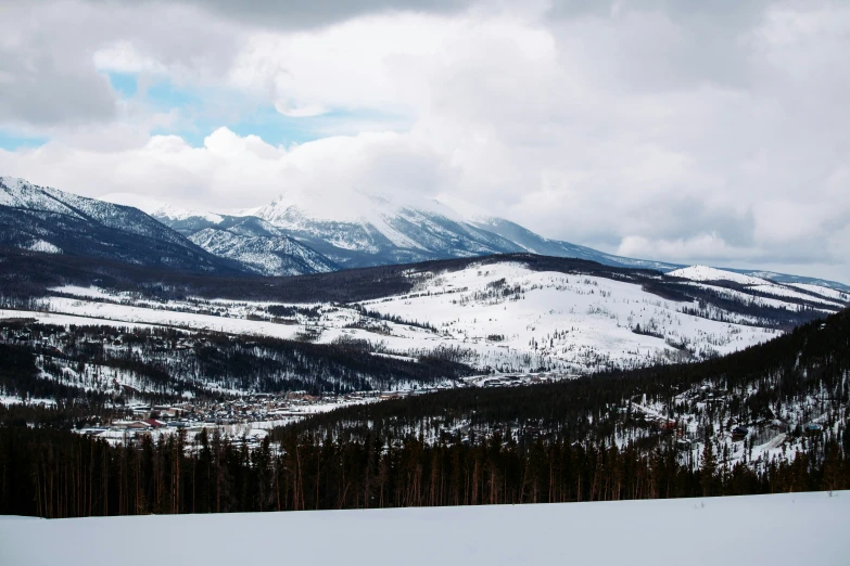 the mountains are covered in a bunch of snow