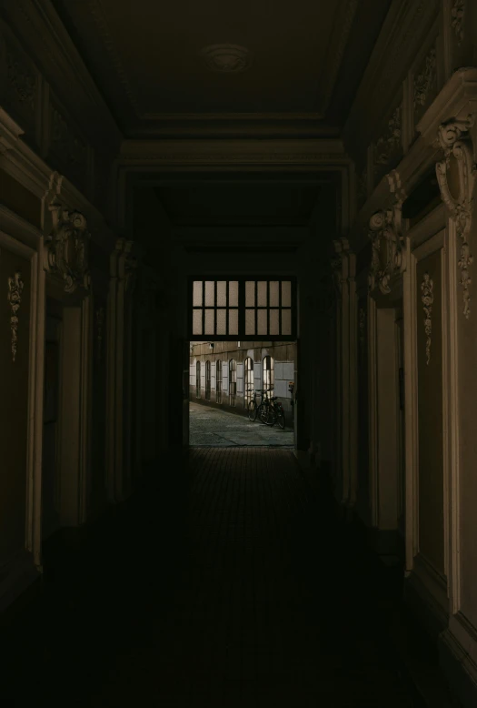 dark alley with two sets of windows and scaffolding