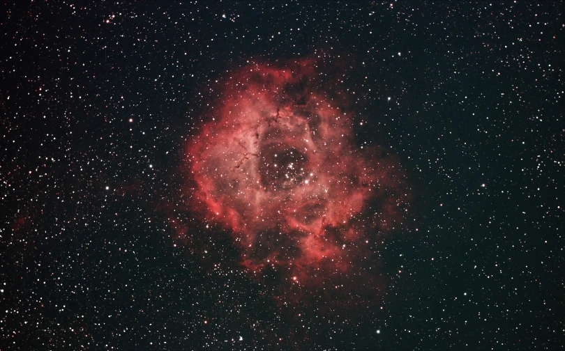 a large, bright star cluster in the night sky