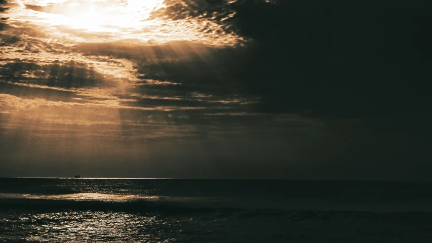 an image of a sun over the water