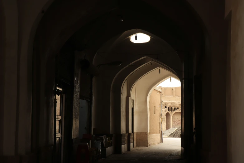 an arch is between two buildings and a staircase