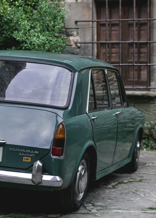 an old car with a window, door and window glass