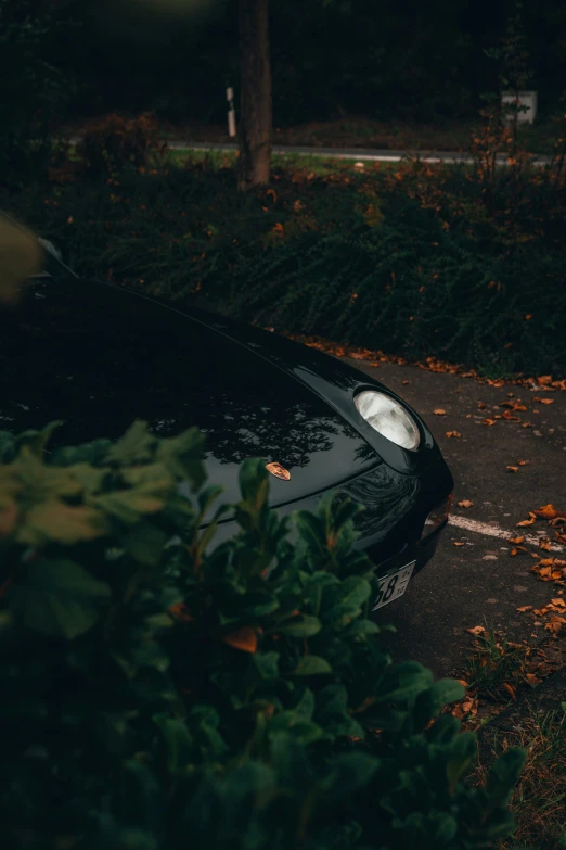 a car sitting outside on a dark evening