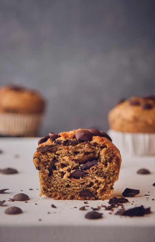 muffin cut in half and placed on top of a piece of paper