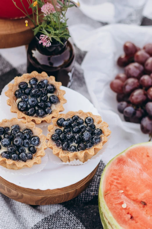 fruit, watermelon and g pies on a table