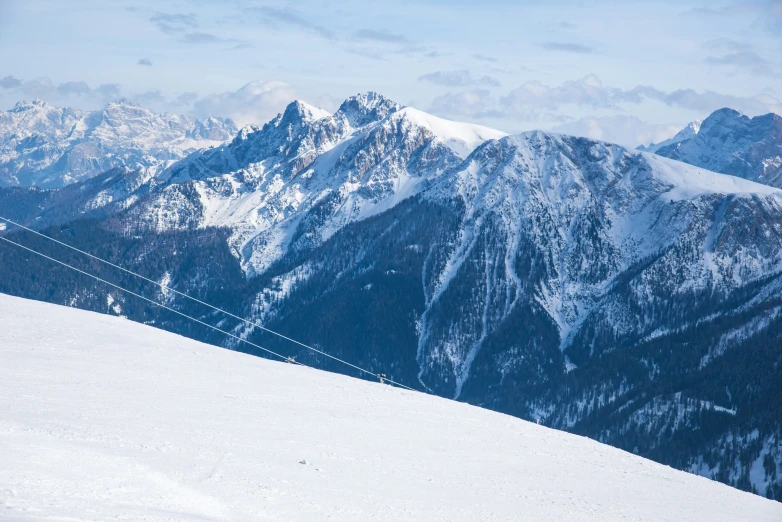 a man standing on top of a snow covered mountain