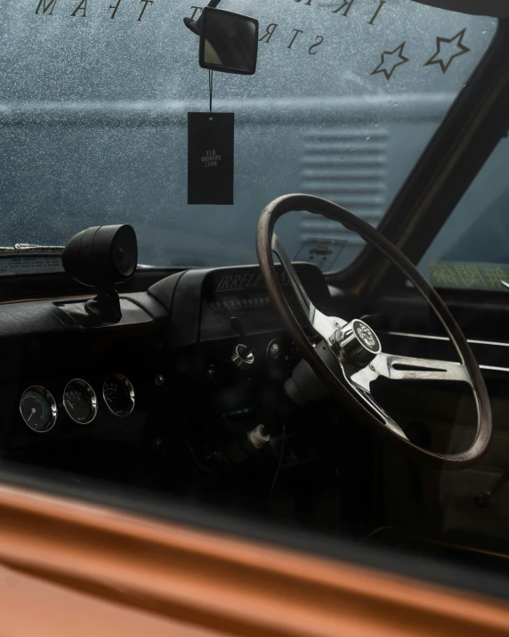 a car interior with a steering wheel and dashboard