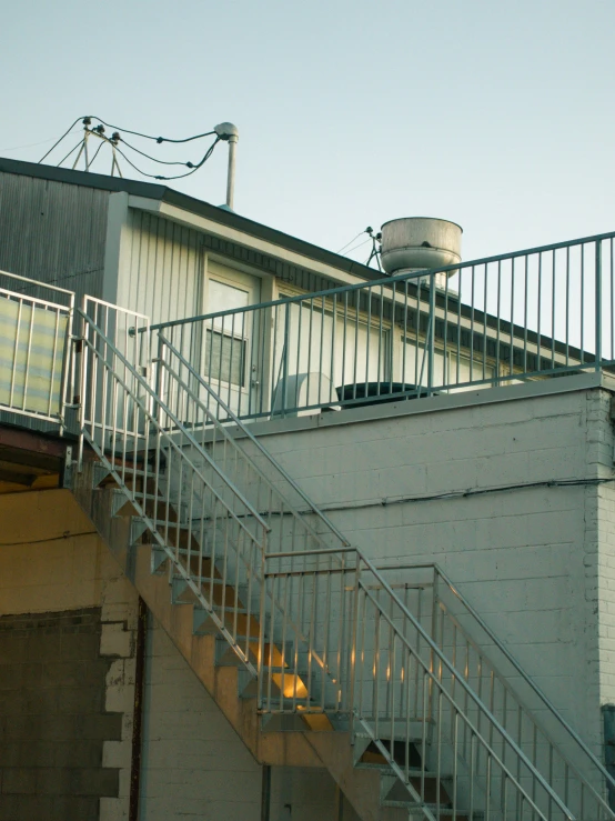 a staircase leading to a building with a fire escape