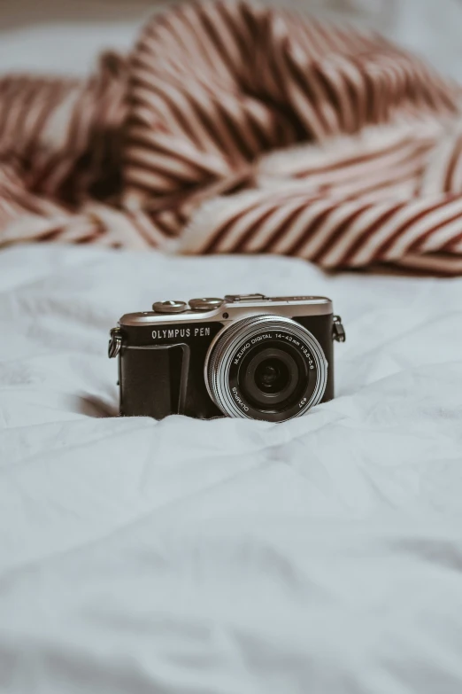 an old po camera set up on top of a bed