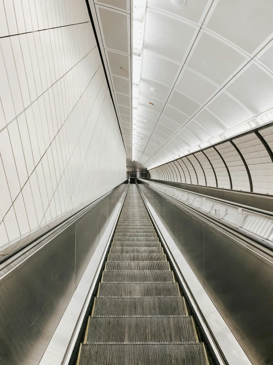 view looking up at an escalator in a modern building