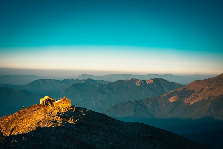 the mountaintop and the ruins of a small building at the top