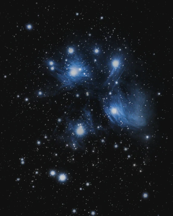 a cluster of bright blue stars in the night sky