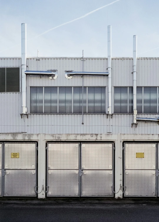 the building has a gated entrance and windows