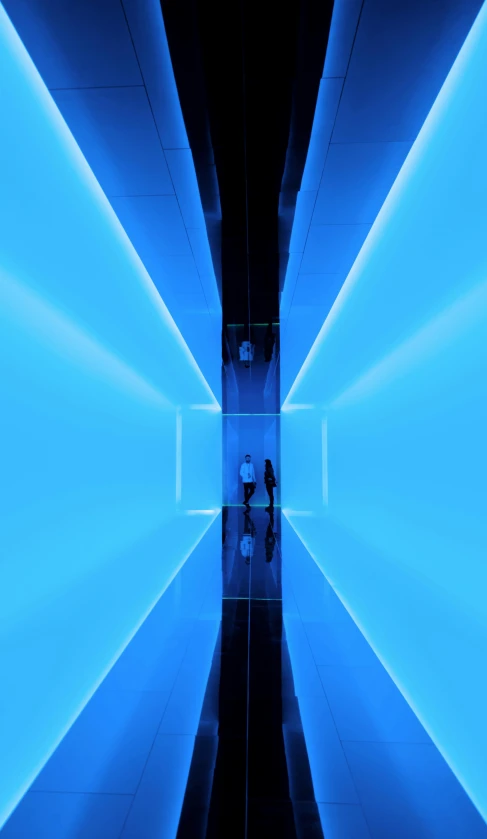 the view through a tunnel showing blue lighting